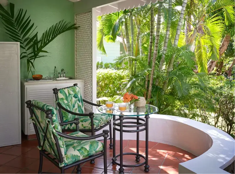 Refreshing veranda space with leafy decor and natural light | East Winds Luxury Resort Saint Lucia