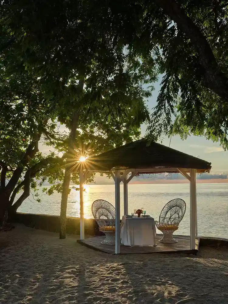 Romantic beachfront dining gazebo at sunset in Saint Lucia – East Winds Resort