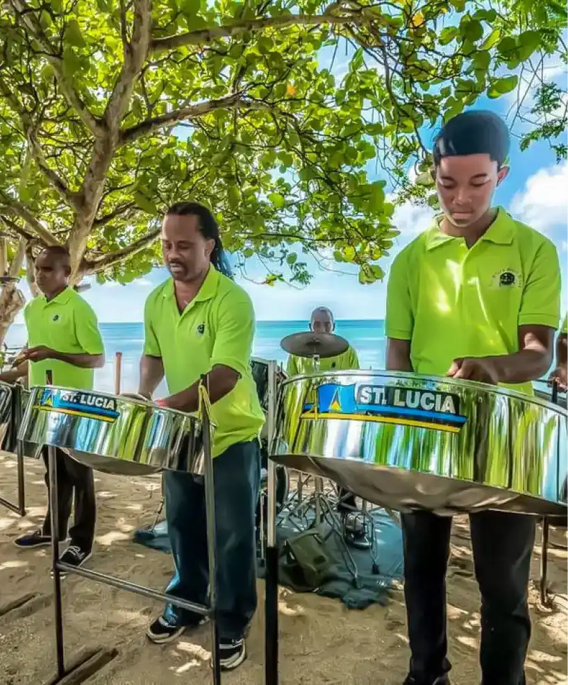 Steel drum band performing on the beach, showcasing St. Lucian culture at East Winds Resort