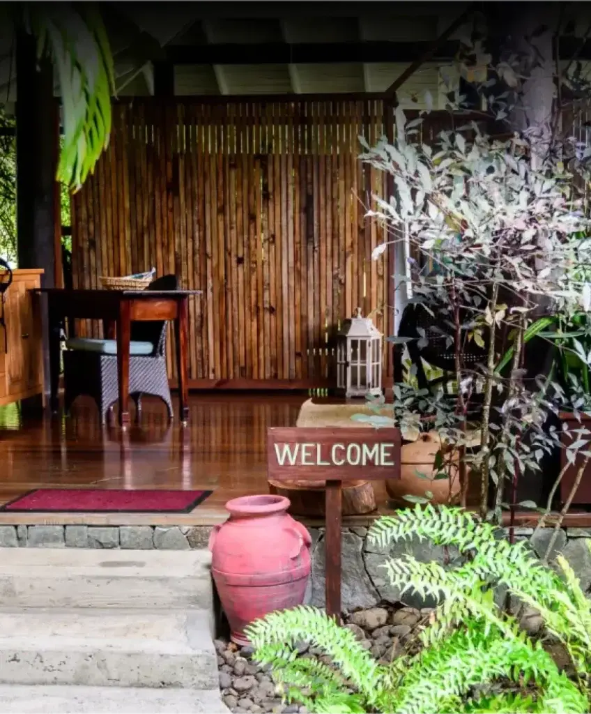East Winds spa entrance framed by lush greenery | East Winds Luxury Resort Saint Lucia